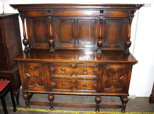 An early 20th Century oak sideboard, in the revived Jacobean...