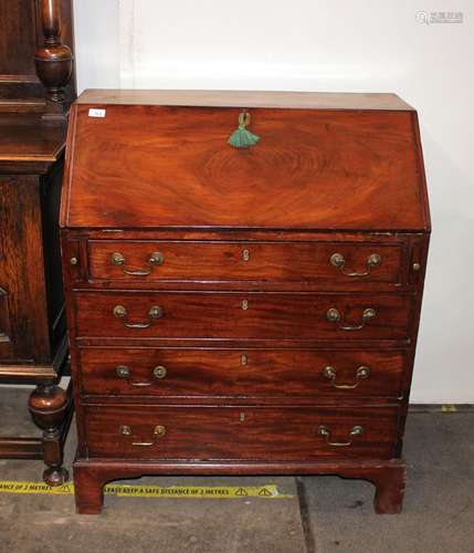 A Georgian mahogany bureau, the fall front opening to reveal...