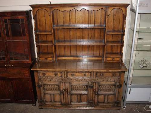 A good quality oak dresser, the shelved and boarded upper se...