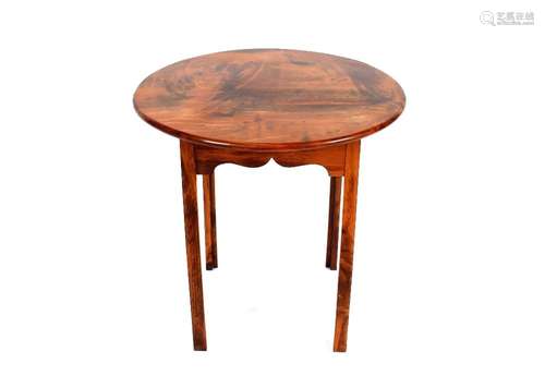 A round occasional table, made of Macrocarpa wood from falle...