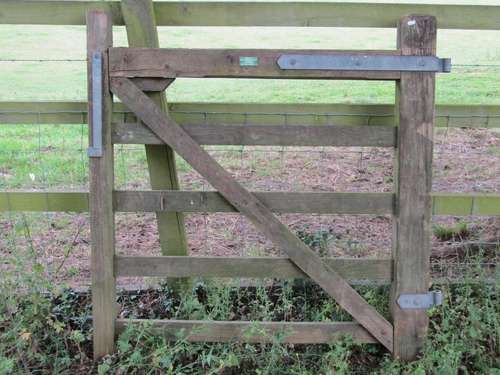 A weathered softwood five bar hunting gate with galvanised f...