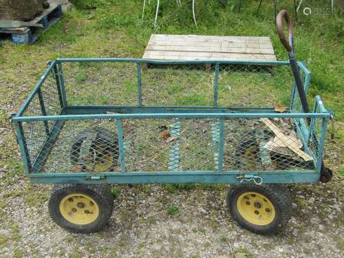 A useful four wheeled hand cart with green painted light ste...