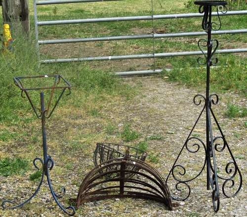 A pair of weathered strapwork wall mounted flower baskets, t...