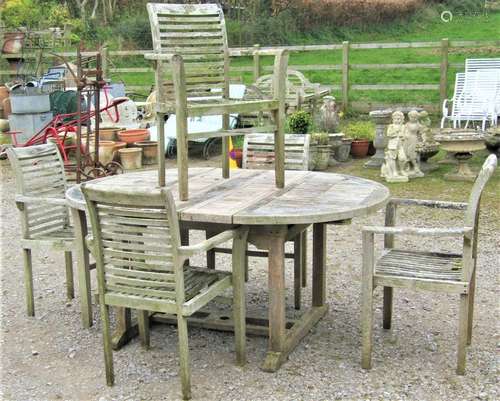 Weathered teak D-end extending garden table with slatted pan...