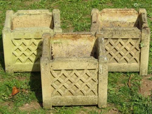 A set of three weathered buff coloured cast composition ston...