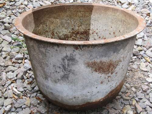 A vintage cast iron cauldron/tub of circular tapered form wi...