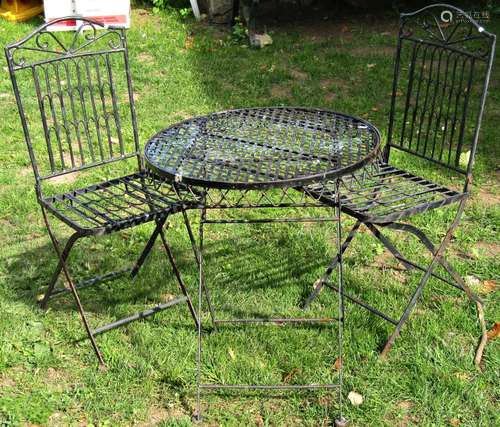 A weathered contemporary three piece folding ironwork garden...