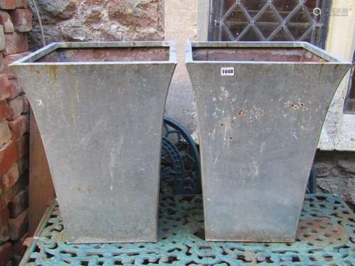 A pair of contemporary weathered tin planters of square tape...