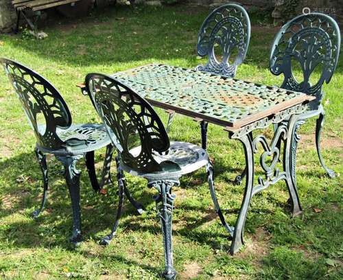 Four similar green painted cast aluminium garden chairs with...