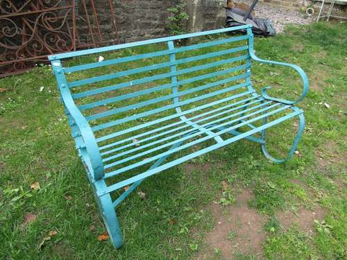 A vintage sprung steel two seat garden bench with strapwork ...