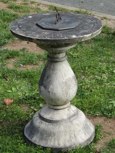 A weathered contemporary sundial of octagonal form with pier...