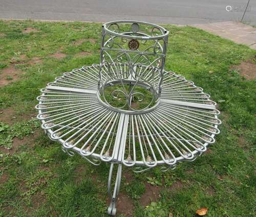 A contemporary cast aluminium sectional tree seat with open ...