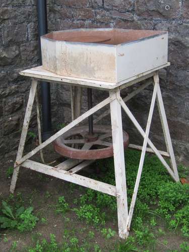 A vintage freestanding potters kick wheel