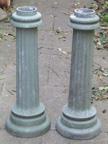 A pair of light green painted cast alloy cylindrical fluted ...