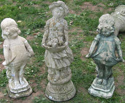 Two cast composition stone garden ornaments in the form of g...