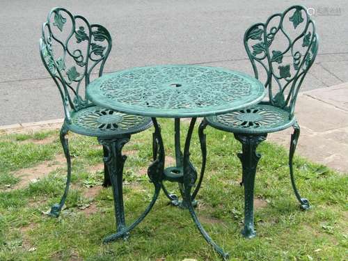 A green painted cast aluminium garden terrace table of circu...