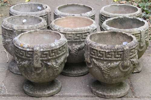 A set/run of eight small weathered composition stone garden ...