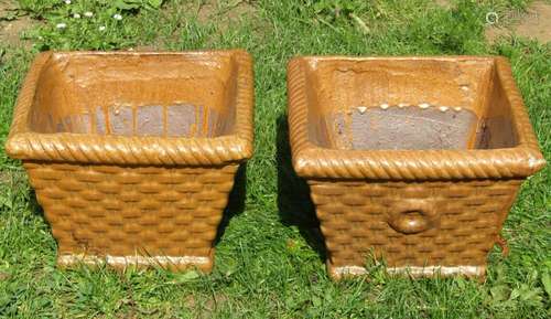 A pair of treacle glazed garden planters in the form of wick...