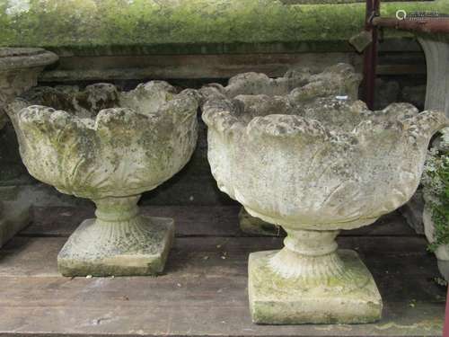 Three matching weathered cast composition stone garden urns ...