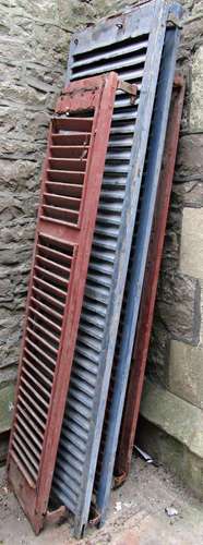 Nineteen old reclaimed painted wooden louvre shutters, the l...