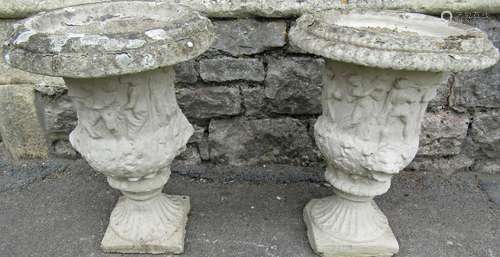 A pair of weathered cast composition stone campana shaped ga...