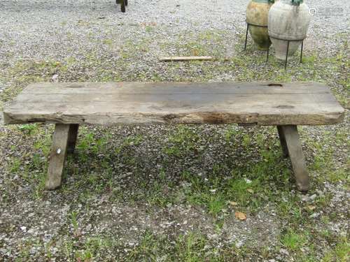 An antique rustic pig bench with threw jointed splayed legs,...