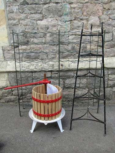 A small fruit press, wooden slatted and steel banded togethe...