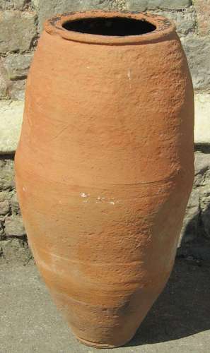 A terracotta slender oviform olive type jar/urn approximatel...