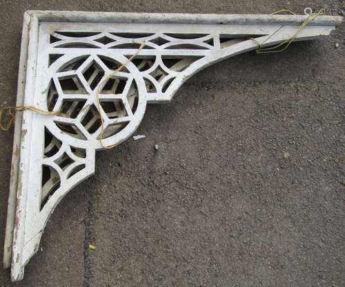 A pair of reclaimed timber porch brackets with decorative pi...