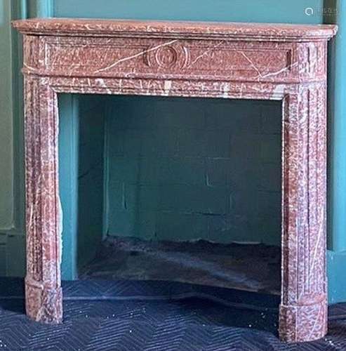 A 19th century marble fireplace in soft pink and cream tones...