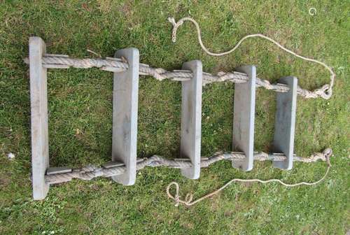 A marine rope ladder with five treads