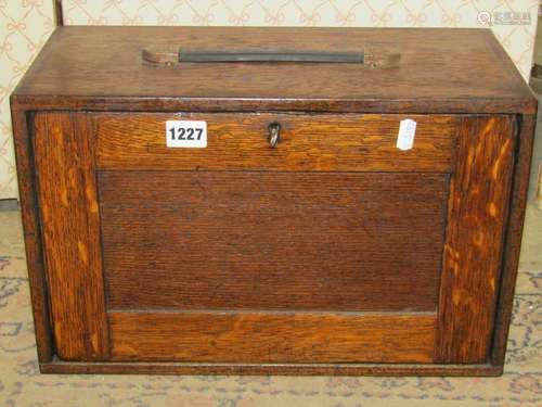 A vintage oak portable engineers tool cabinet enclosed by a ...