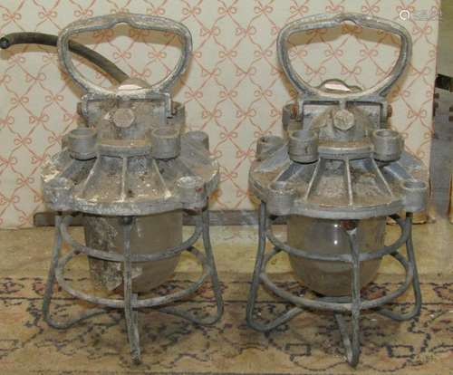 A pair of vintage GEC cast metal lanterns with basket enclos...