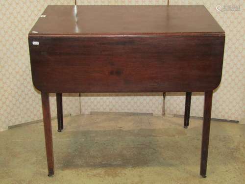 A Georgian mahogany Pembroke table fitted with a three quart...