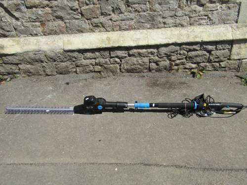 A Bosch electric hedge trimmer model AHS55-16, used but in o...