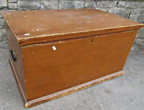 A 19th century stained pine blanket box with hinged lid with...