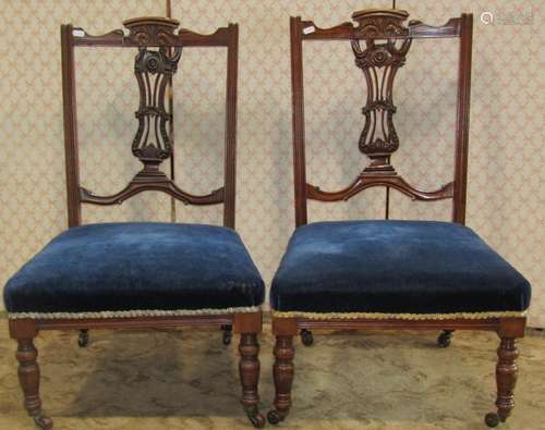 A pair of low Edwardian walnut framed occasional/drawing roo...