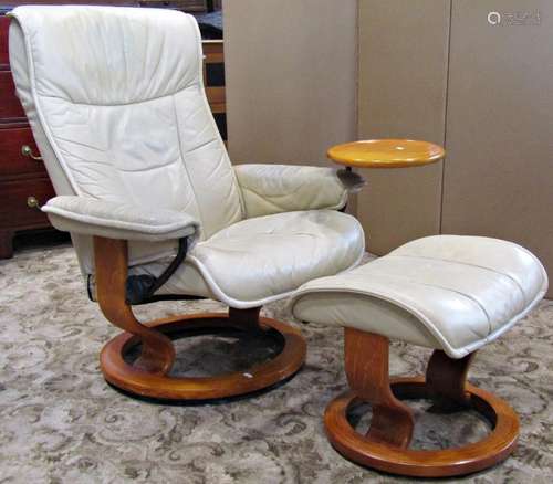 An Ekorness Stressless swivel and adjustable lounge chair wi...