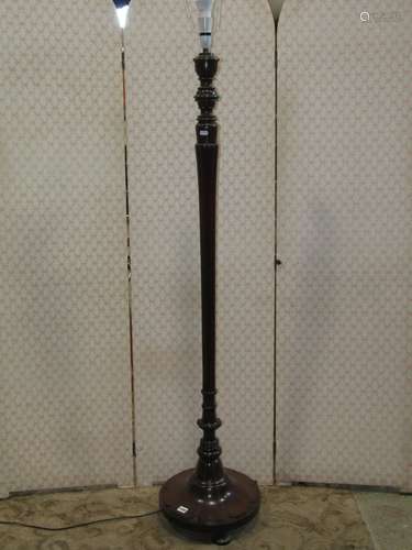 A mahogany standard lamp in the Georgian style with fluted a...