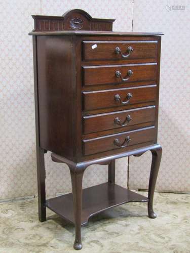 An Edwardian mahogany sheet music cabinet of five drawers on...