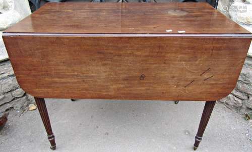 A 19th century mahogany Pembroke table fitted with the usual...