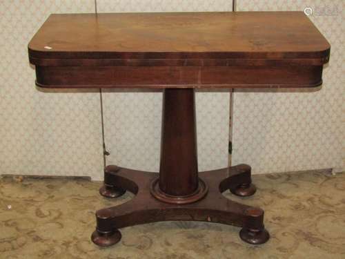 A Regency mahogany D end foldover top card table on tapering...