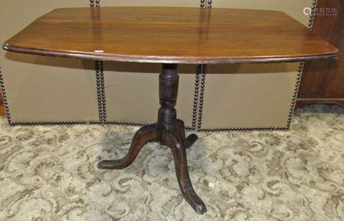 An oak snaptop occasional table, the rectangular top with cu...