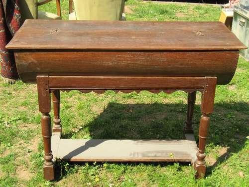 An 18th century oak dough bin with hinged lid, raised/cradle...