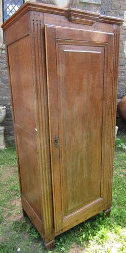 An antique oak hanging cupboard, freestanding and enclosed b...