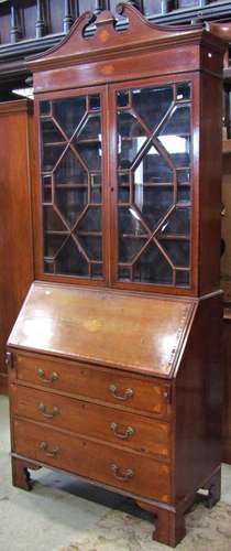 An inlaid Edwardian mahogany bureau bookcase with satinwood ...