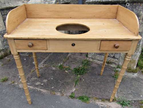 A 19th century stripped and waxed pine washstand with raised...