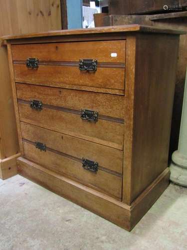 A small Edwardian satin walnut bedroom chest of three long d...