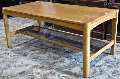 A contemporary Ercol light oak occasional table of rectangul...