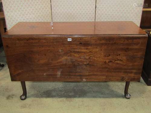 A Georgian mahogany pad foot dining table with rectangular d...